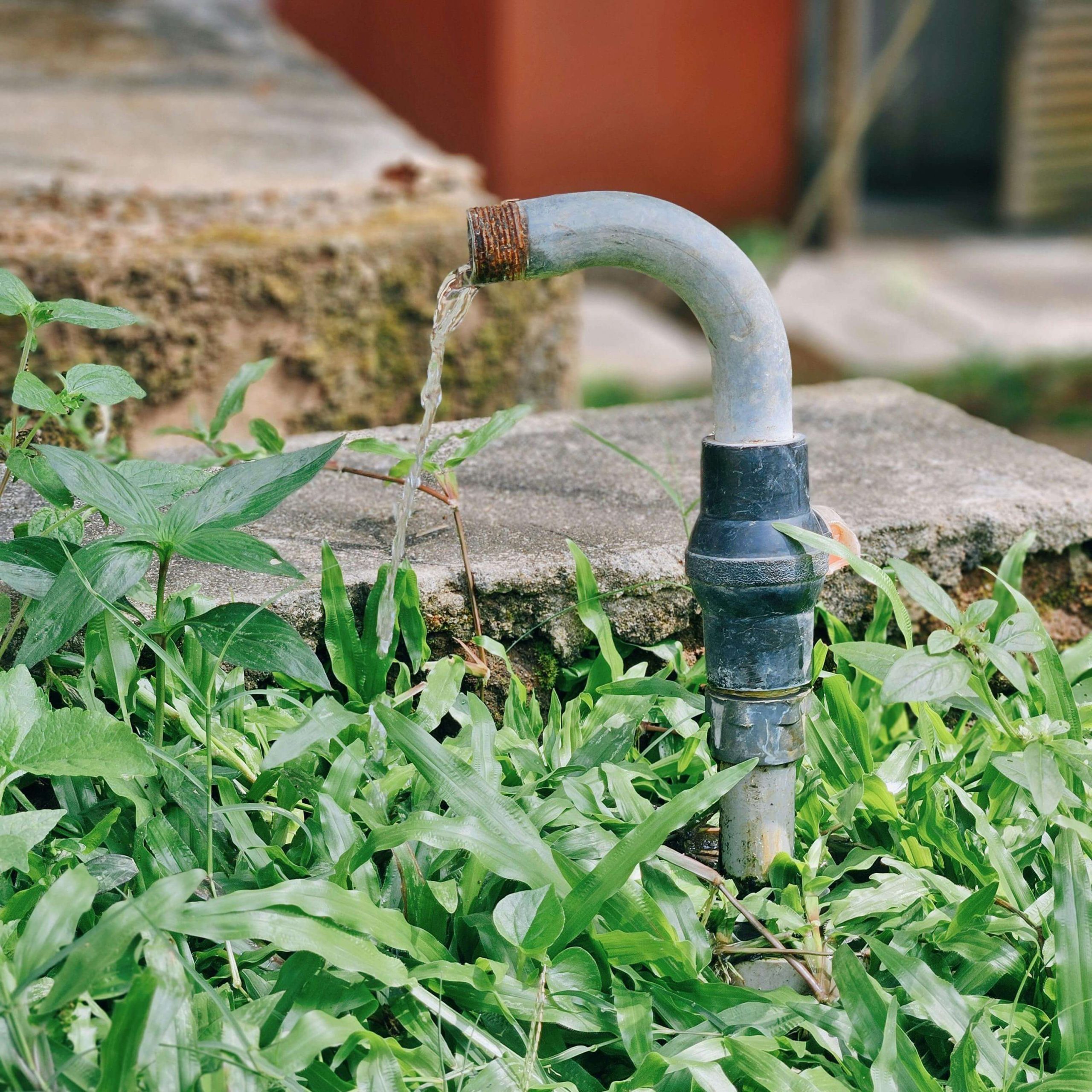 Active water leak from outdoor pipe in Hot Springs requiring emergency repair.
